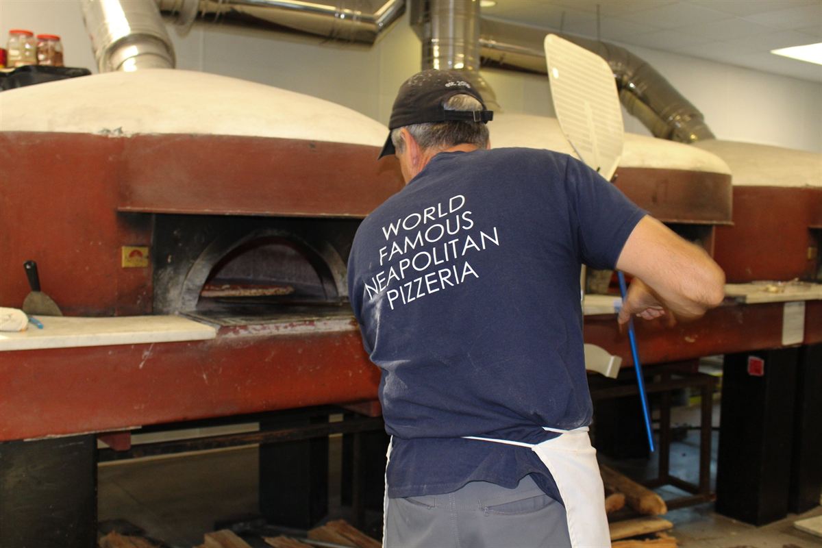 Pizzaiolo at the oven